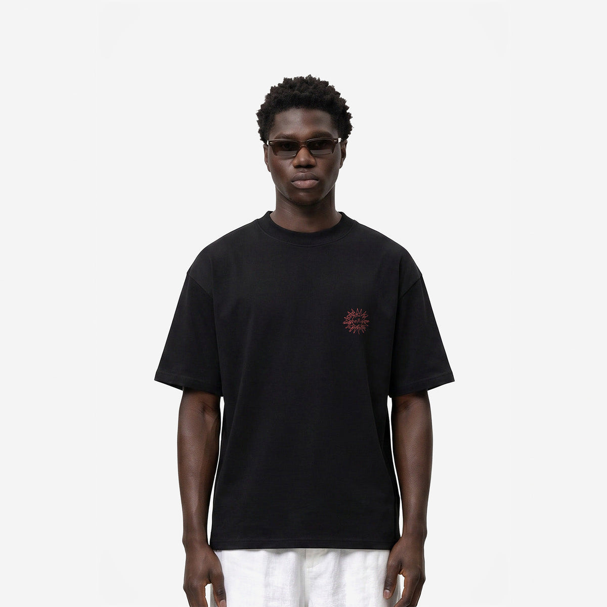 Born To Experience Tee in Black – worn by model, front view