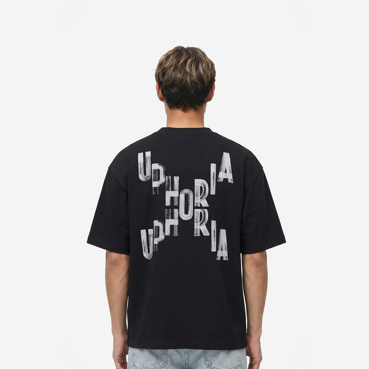 Signature Cross Tee in Black – worn by model, back view