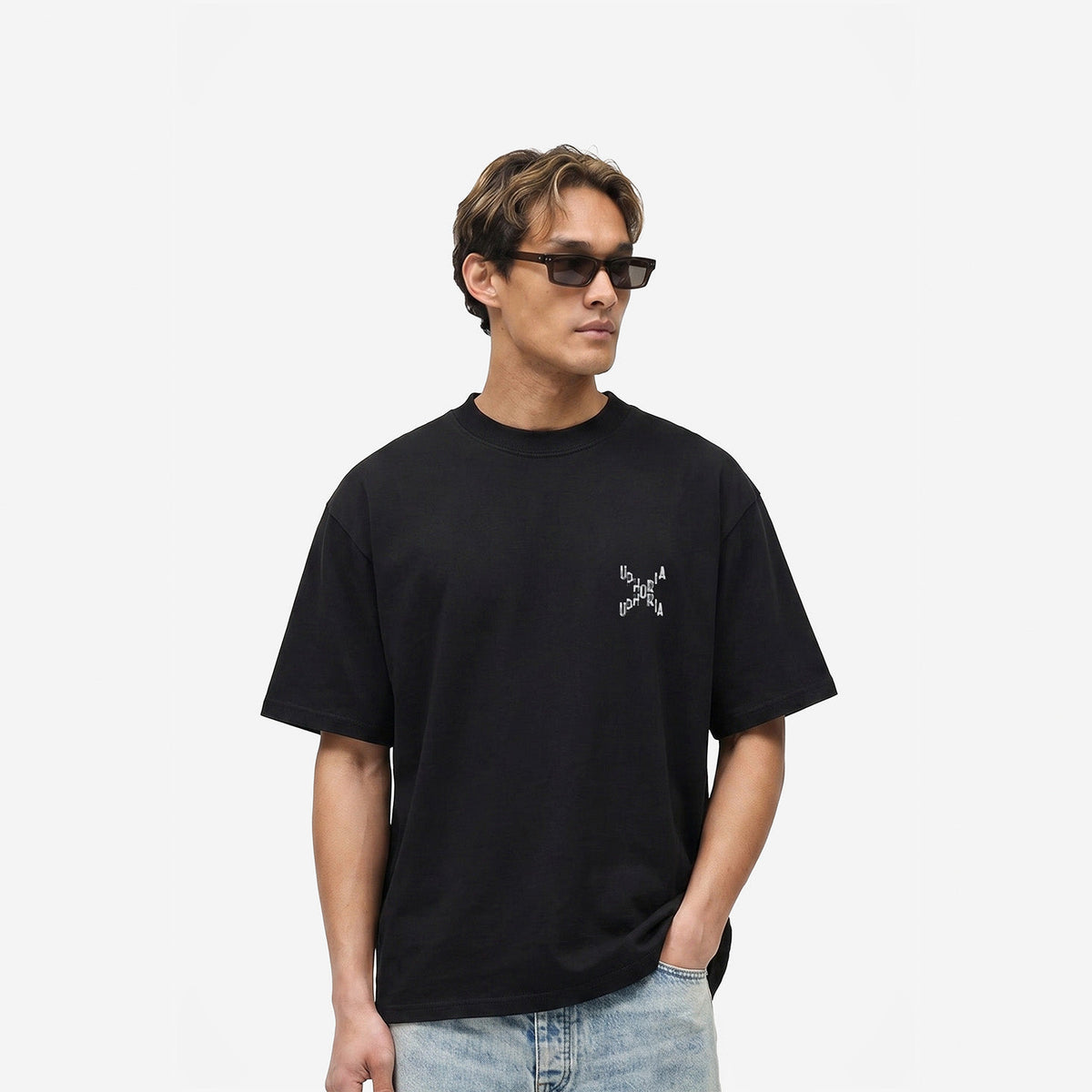 Signature Cross Tee in Black – worn by model, front view