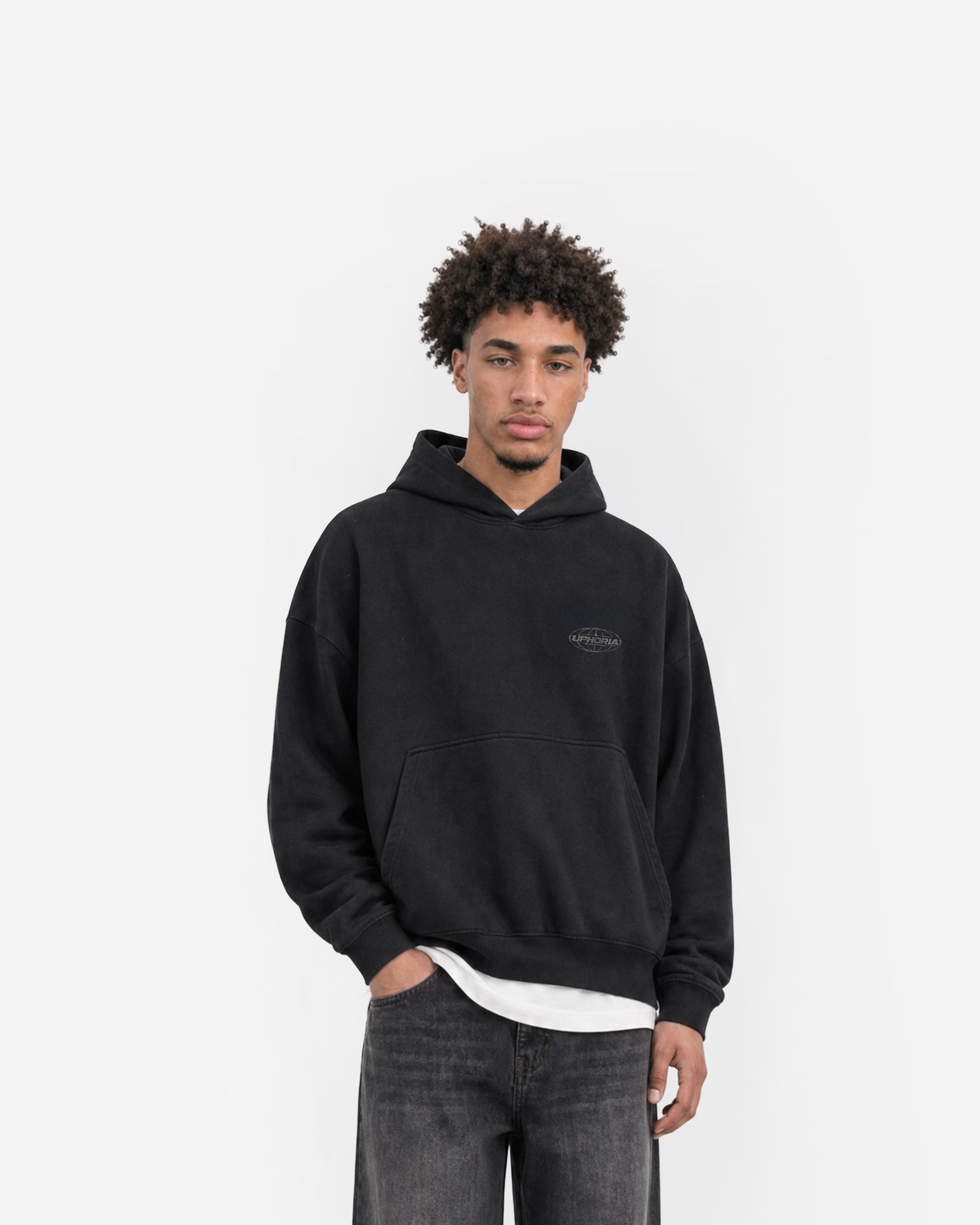 Globe Hoodie in Black – worn by model, front view