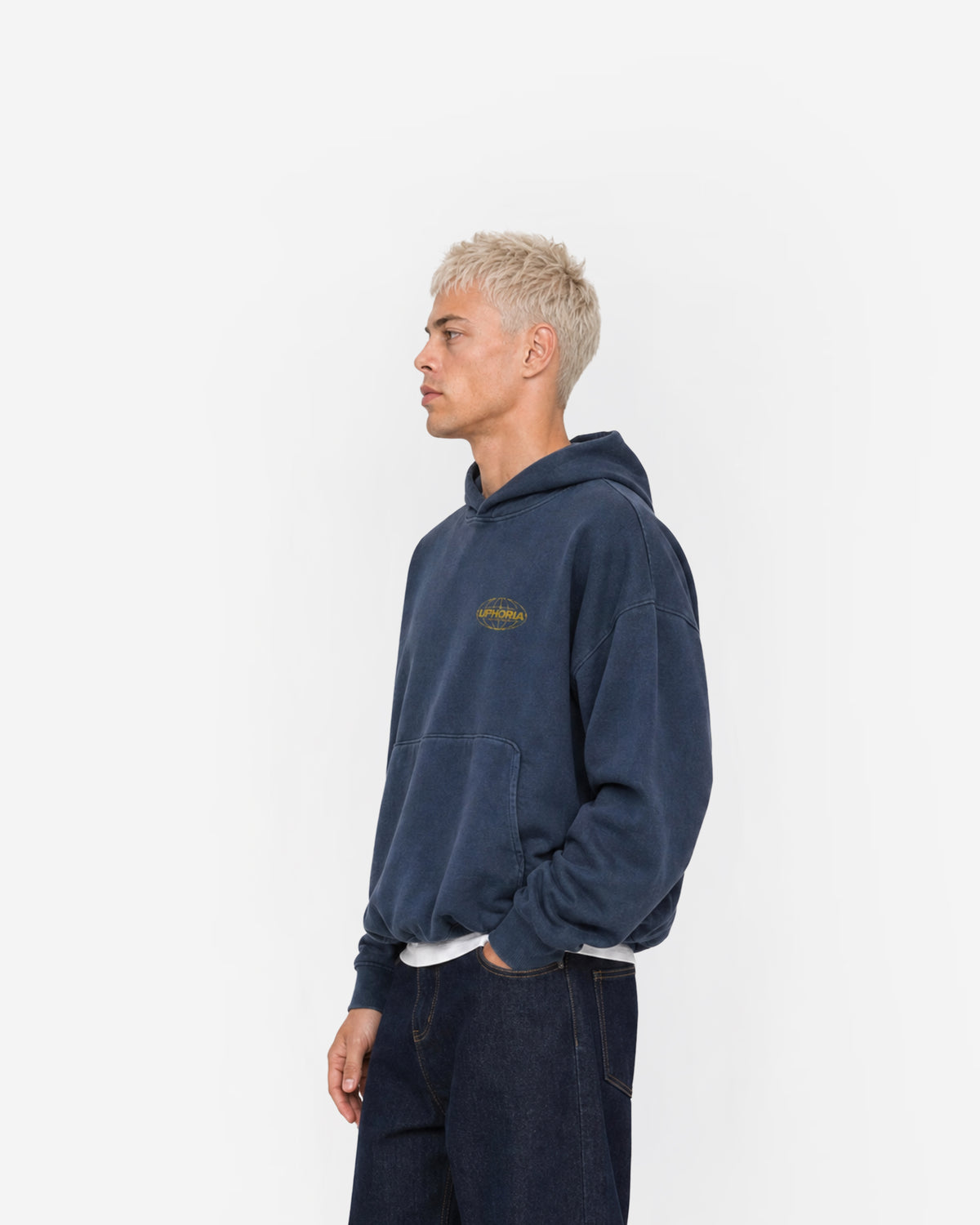 Globe Hoodie in Navy – worn by model, side view