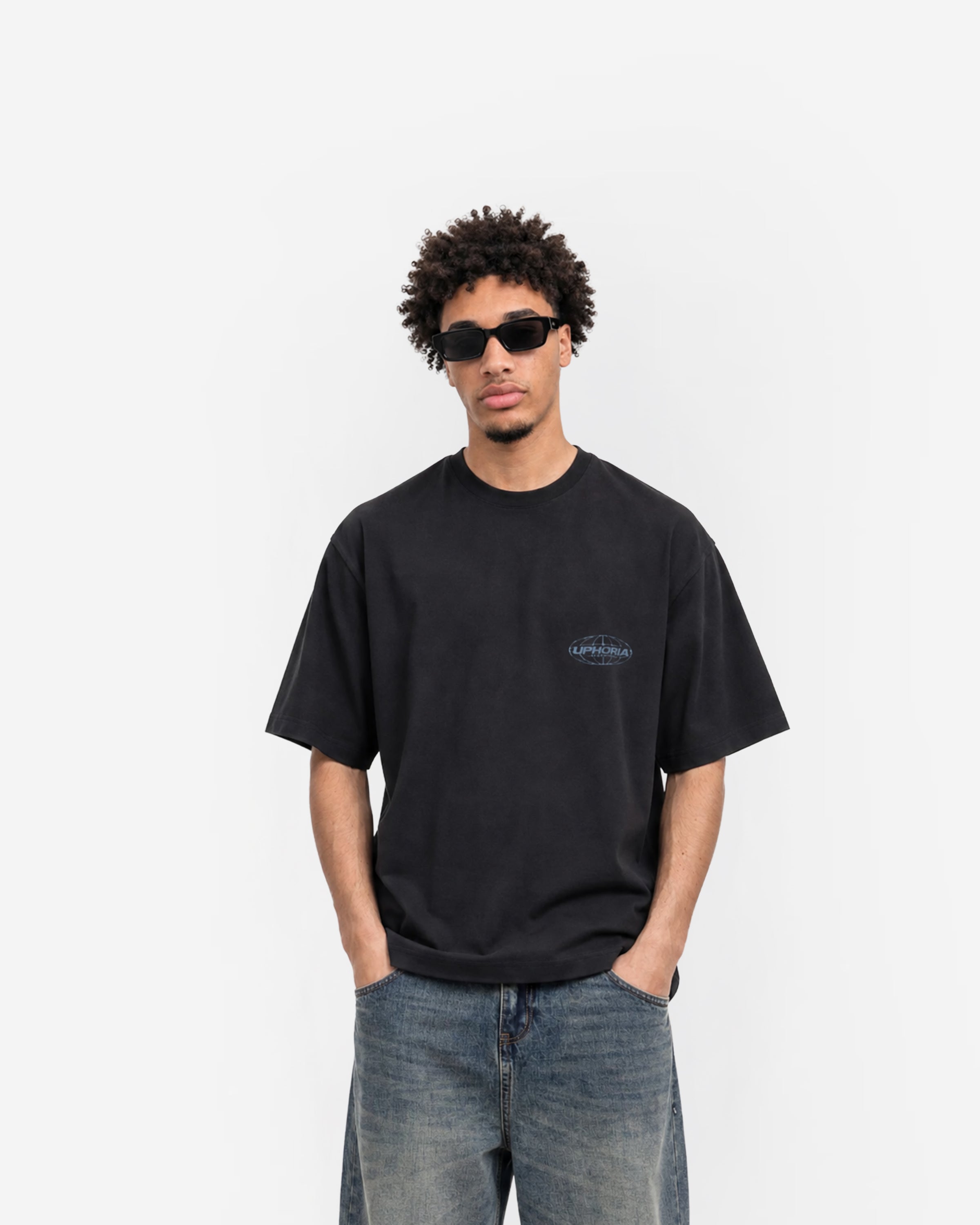 Globe Tee in Black – worn by model, front view