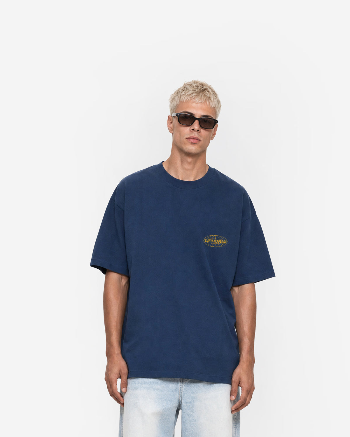 Globe Tee in Navy – worn by model, front view