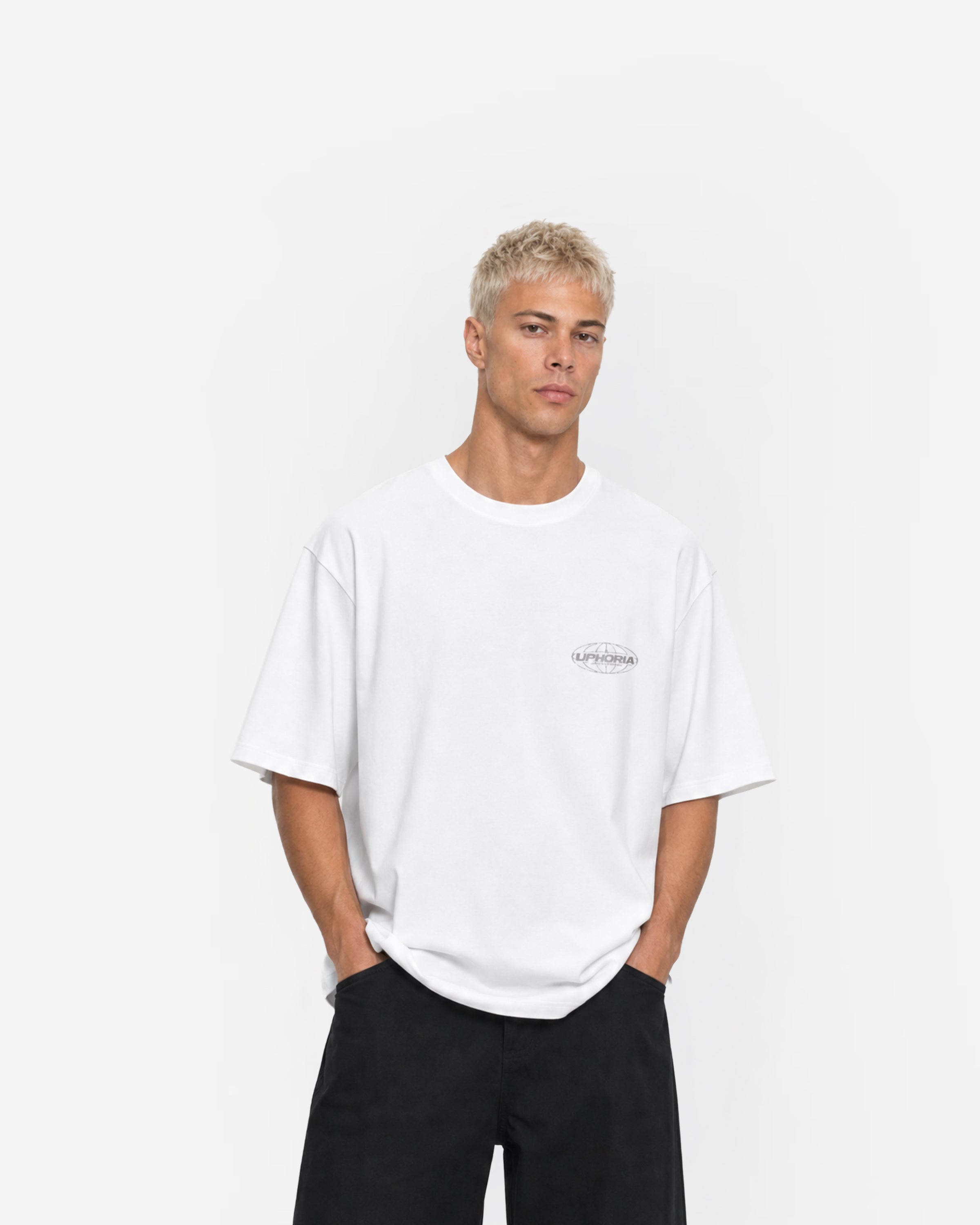 Globe Tee in White – worn by model, front view
