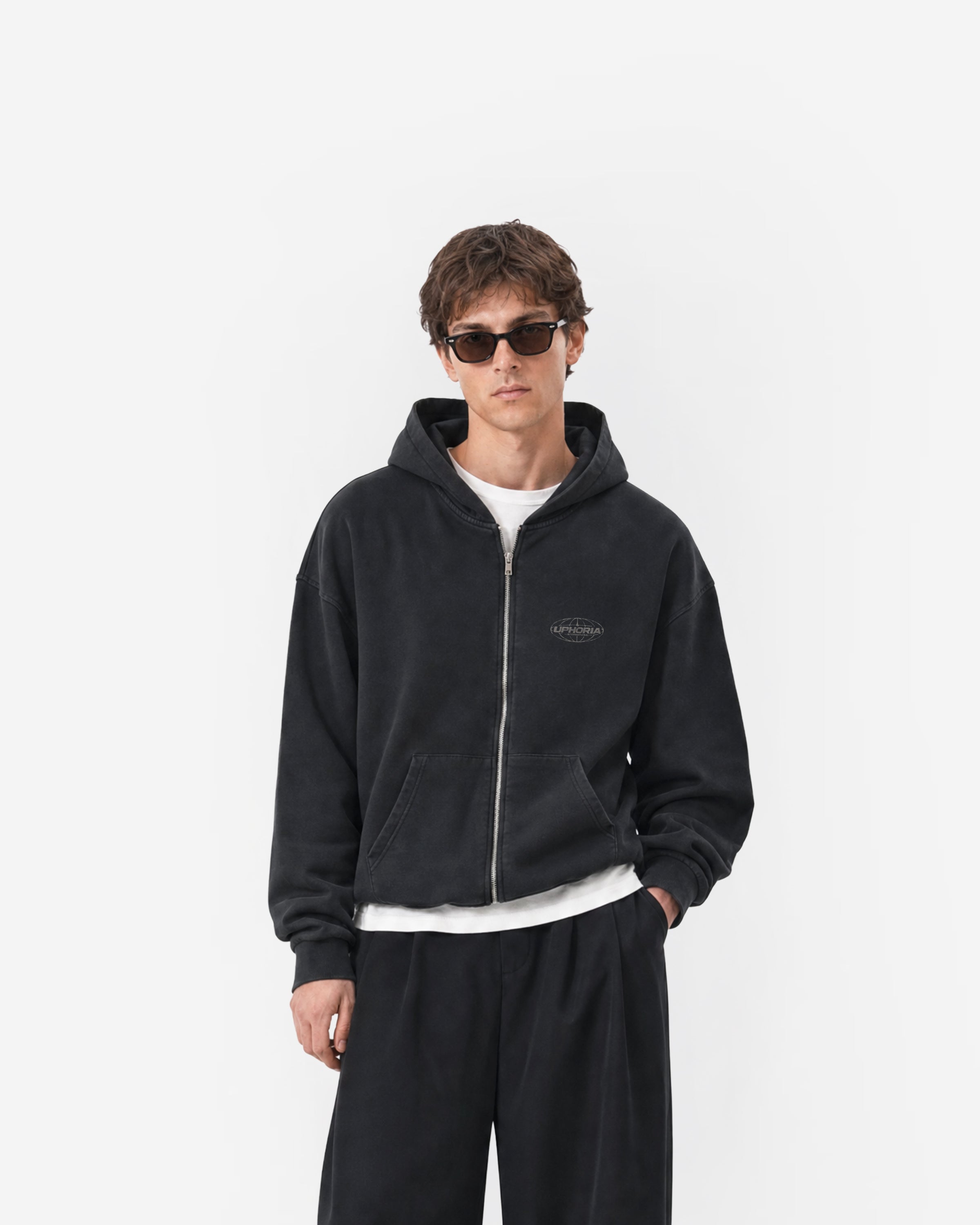 Globe Zip Hoodie in Black – worn by model, front view