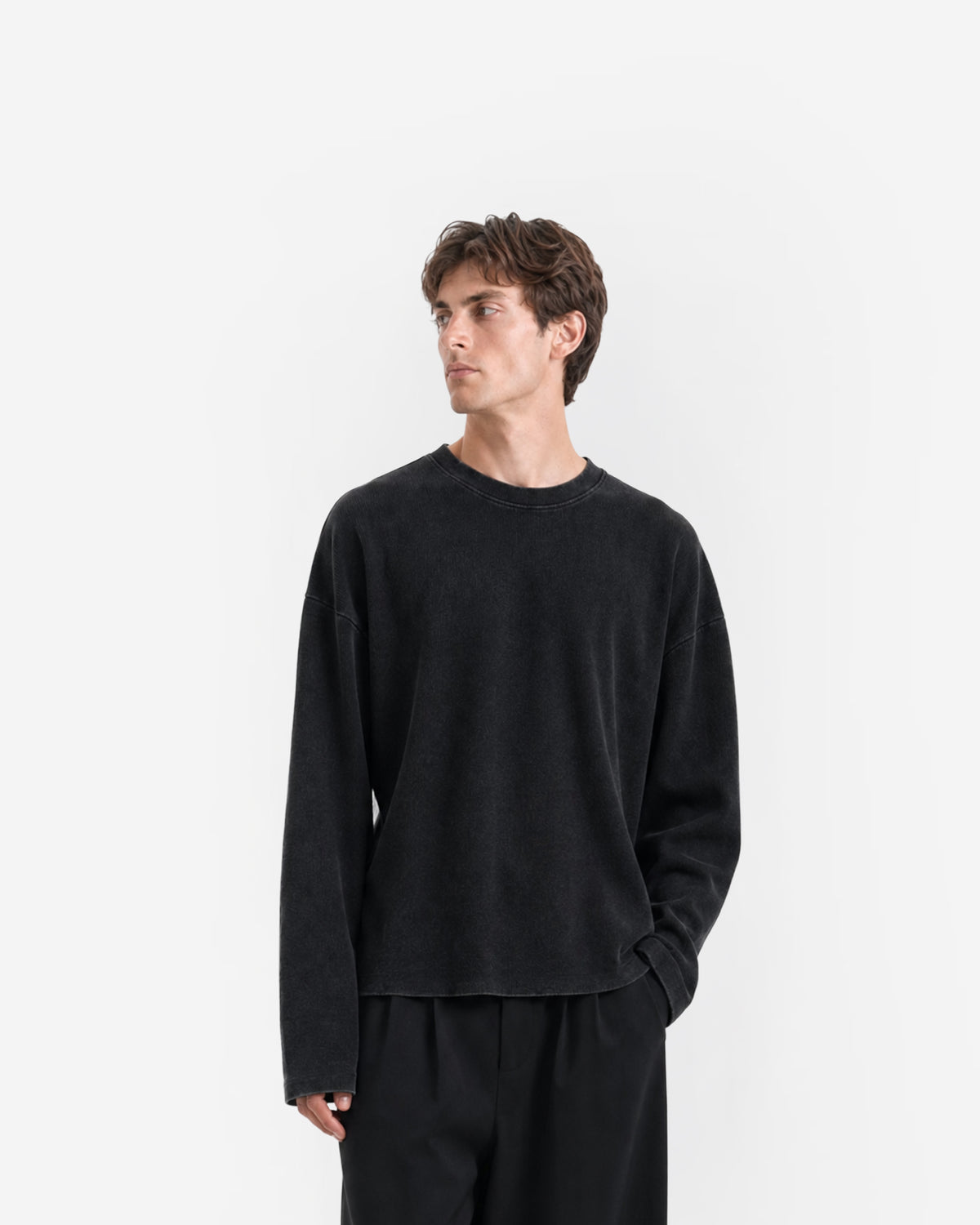 Raw Edge Long Sleeve Tee in Jet Black – worn by model, front view