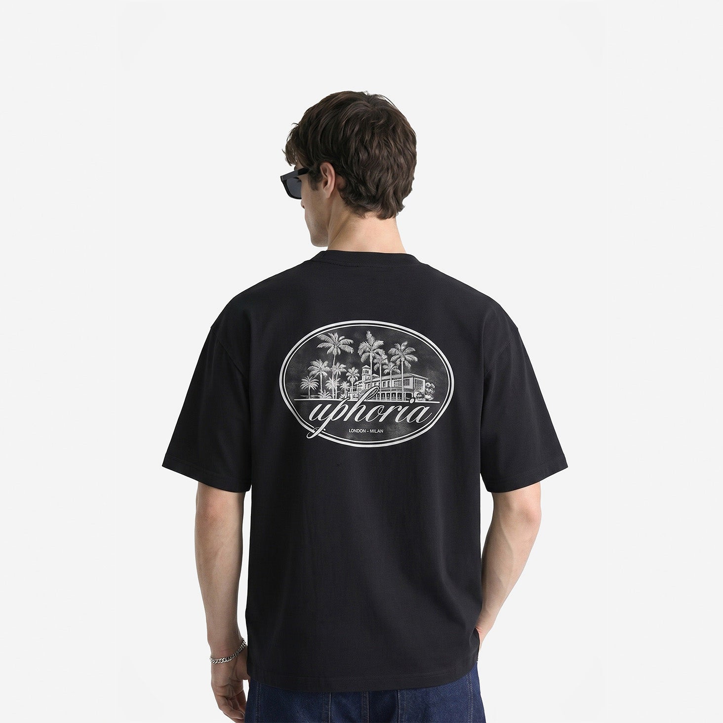 Summer Resort Tee in Black – worn by model, back view
