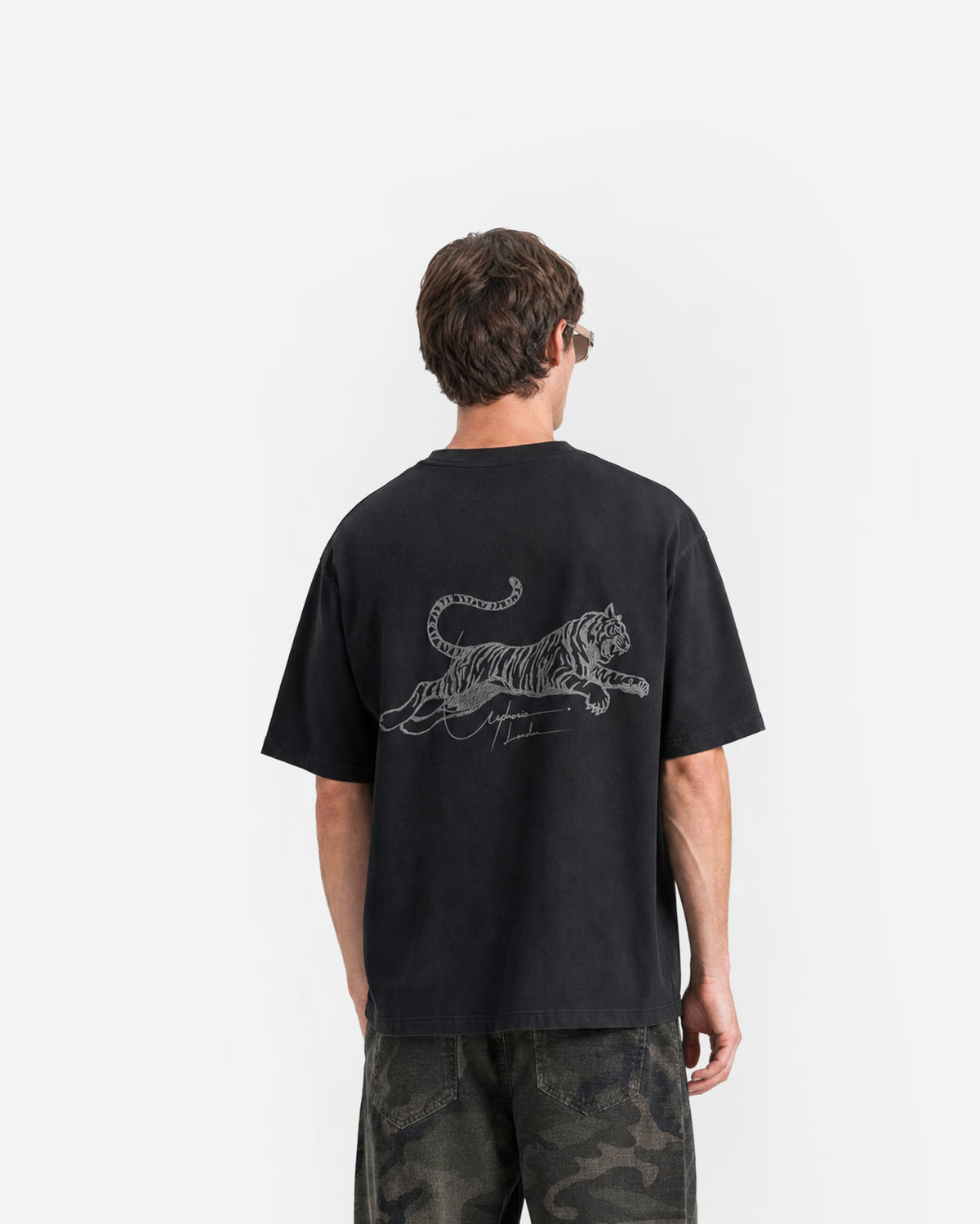 Tiger Signature Tee in Black – worn by model, back view