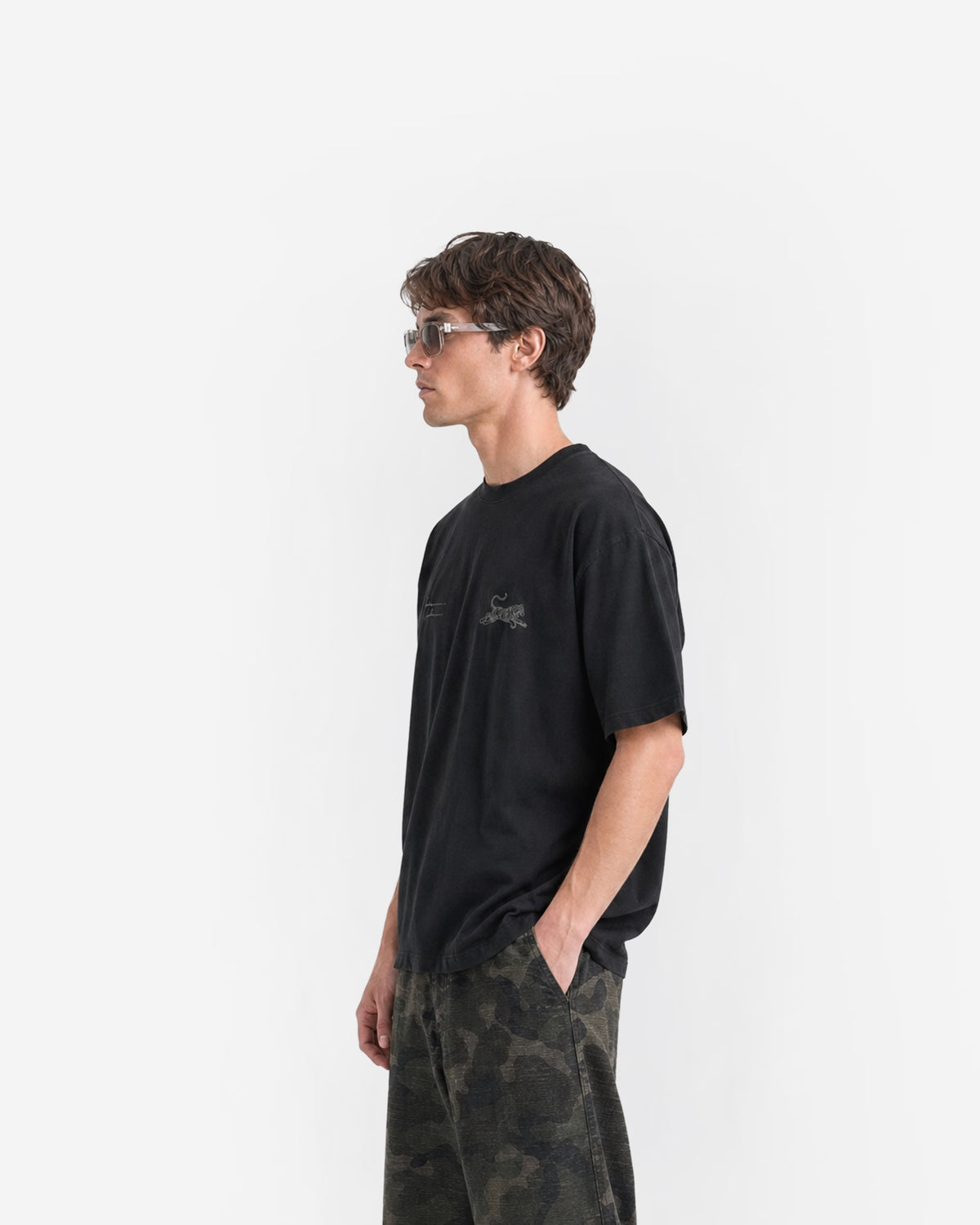 Tiger Signature Tee in Black – worn by model, side view