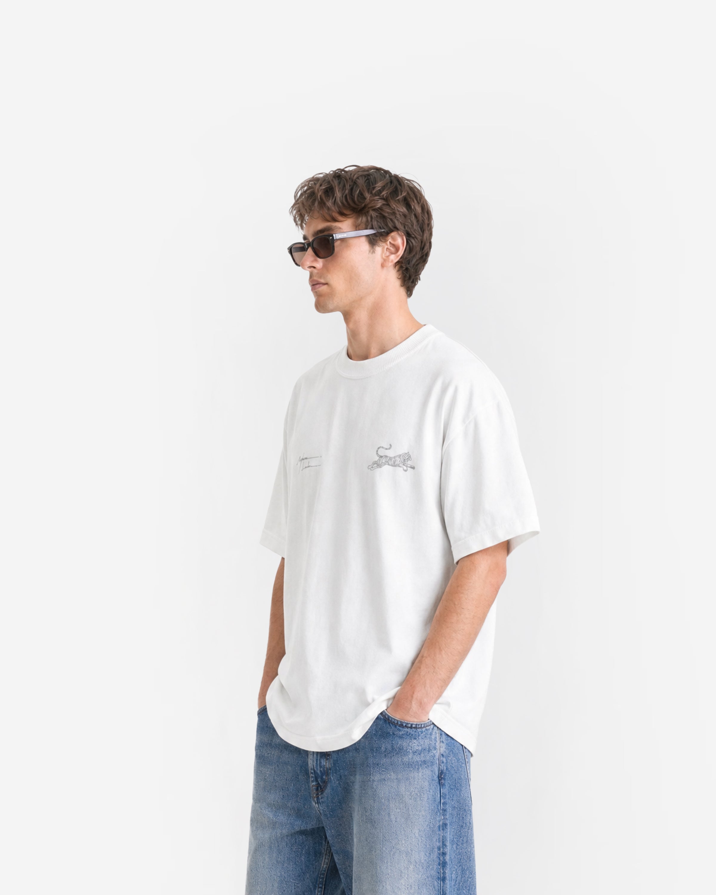 Tiger Signature Tee in White – worn by model, side view