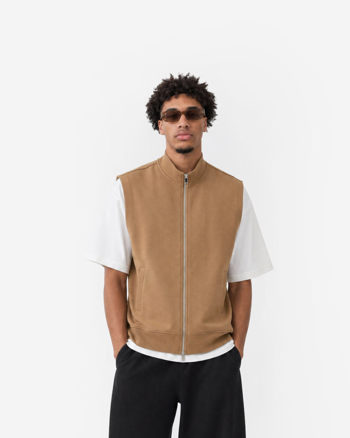 Paddock Gilet in Brown – worn by model, front view