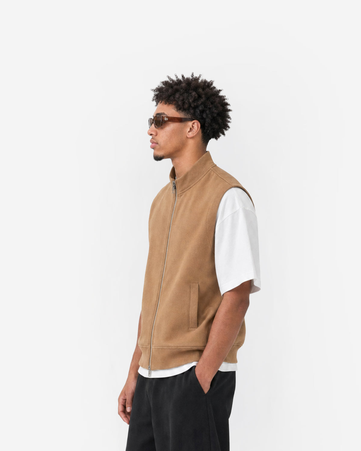 Paddock Gilet in Brown – worn by model, side view