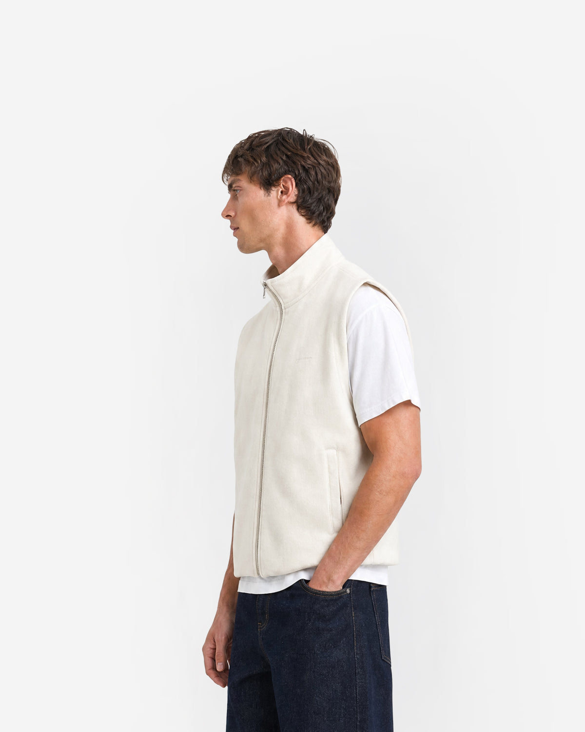 Paddock Gilet in Ecru – worn by model, side view
