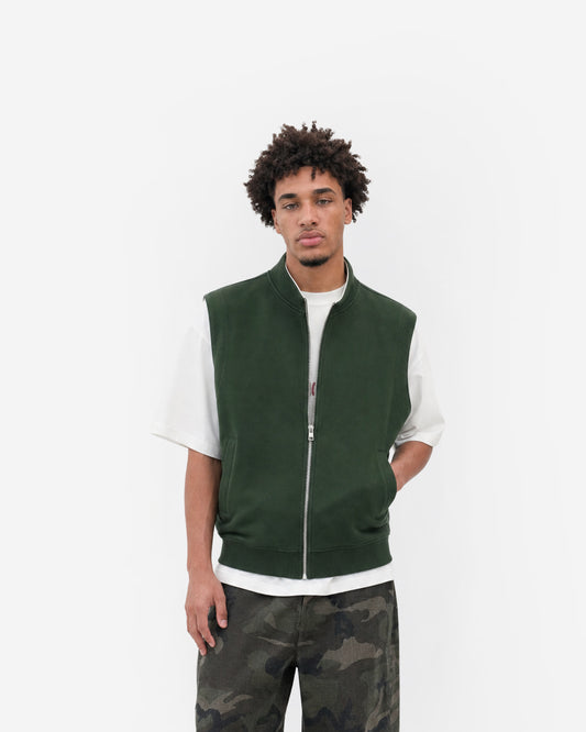 Paddock Gilet in Forest Green – worn by model, front view