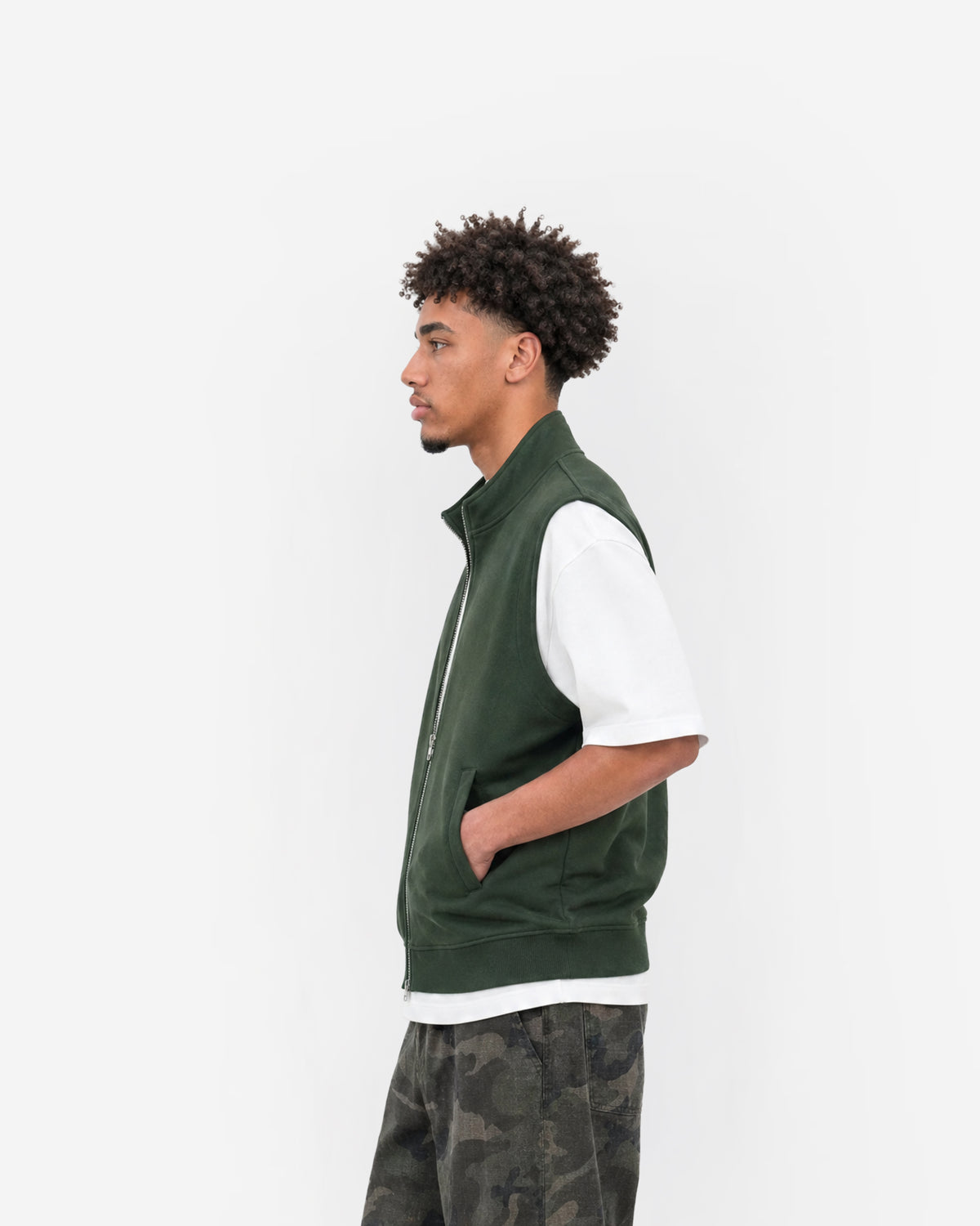 Paddock Gilet in Forest Green – worn by model, side view
